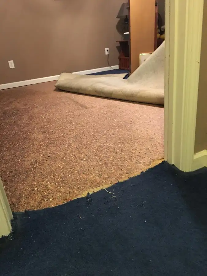 Carpet pad removal revealing water damage during Drying & Dehumidification in Stuarts Draft